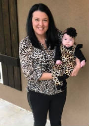 Dixie Kugler holding a toddler