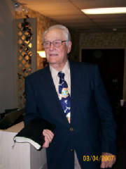 Late Reverend James Ray holding a bible